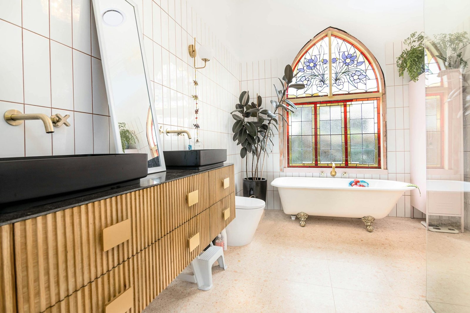 Luxurious bathroom in Melbourne featuring stained glass windows and modern decor.